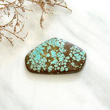 Large Faint Green Freeform Number 8 Turquoise Background