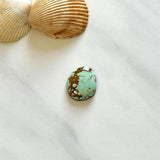 Small Faint Blue Freeform Number 8 Turquoise Background