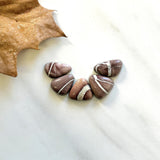 Small Red Mixed White Buffalo Dolomite, Set of 5 Background