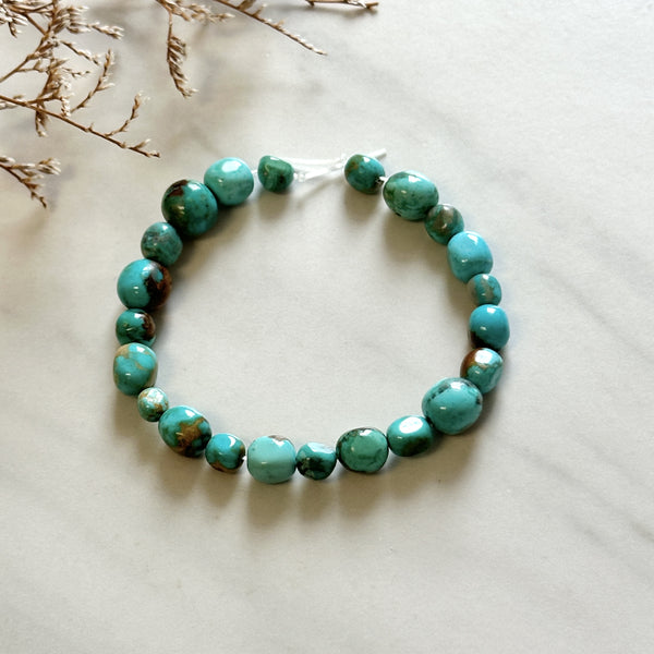 Small Sky Blue Smooth Nugget Beads Fox Turquoise Background