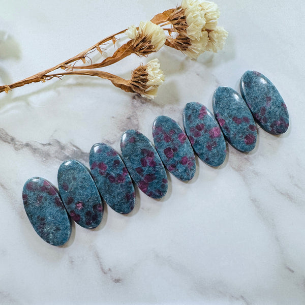 Large Deep Blue Oval Ruby in Kyanite, Set of 8 Background