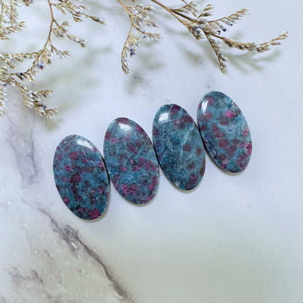 Large Deep Blue Oval Ruby in Kyanite, Set of 4 Background
